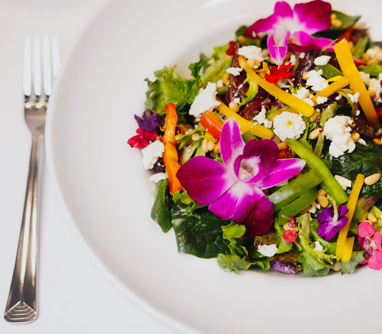 Salad with flowers on it