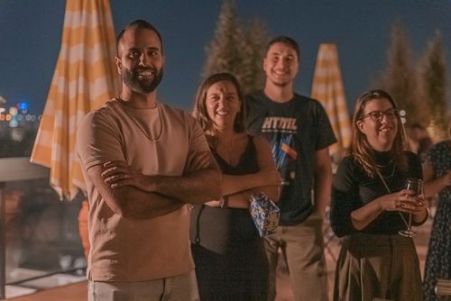 4 happy people posing