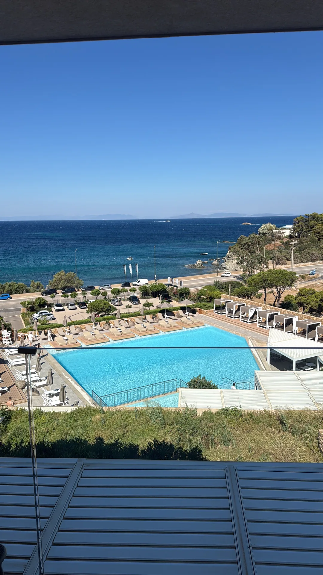 The summit hotel's pool overlooking the beach and the sea near Athens