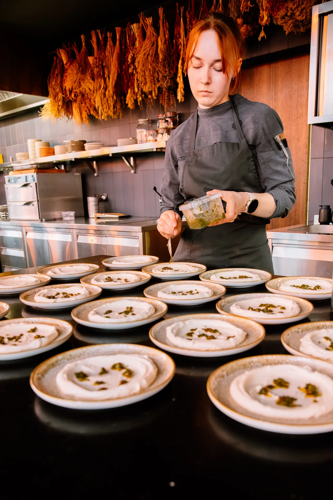A chef plating a course at one of the retreat's dinners in Tallinn