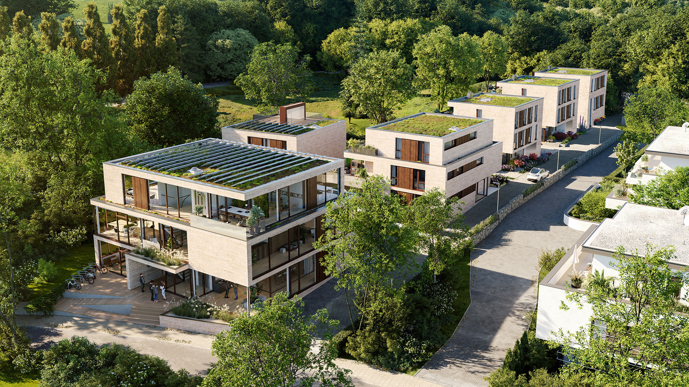 Visualisierung des Neubauprojekts "New Sphere" in Aachen aus der Vogelperspektive. Zu sehen sind ein Bürogebäude, zwei Apartmentgebäude und sechs Stadthäuser inmitten der Natur.