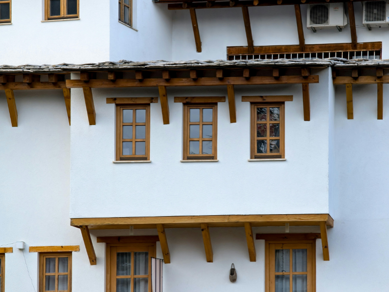 wooden windows with white painted walls