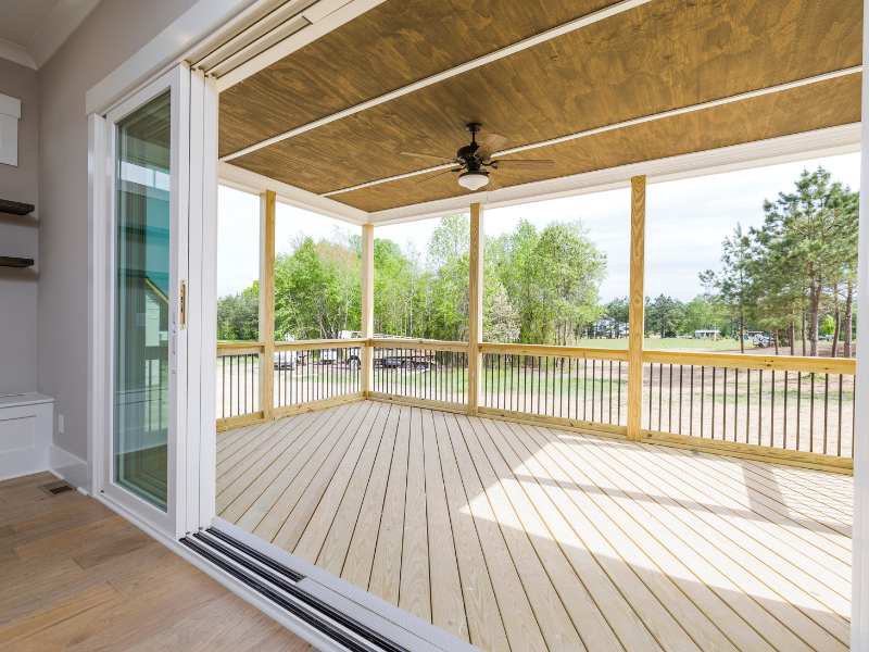 wide verandah with neutral and wood accents
