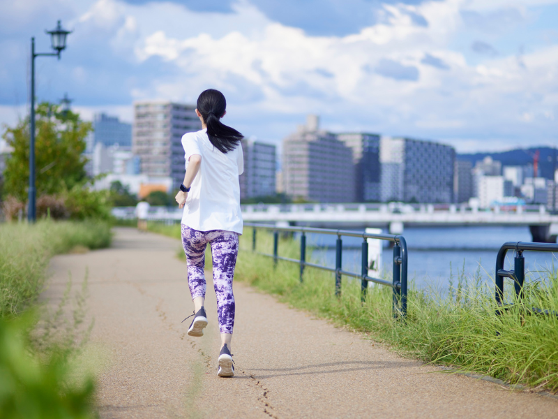 woman running on a gated commuunity