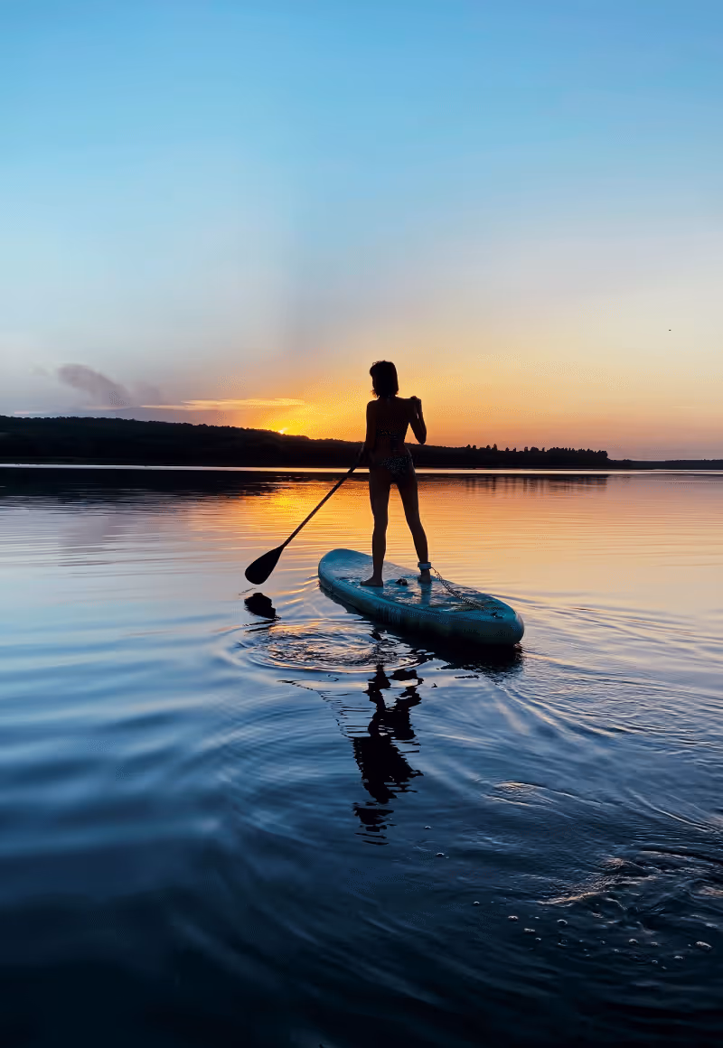 Paddle boarding at sunset