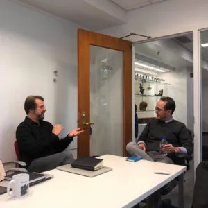 Sven Heinrich describing content development to Amgen Foundation President Eduardo Cetlin