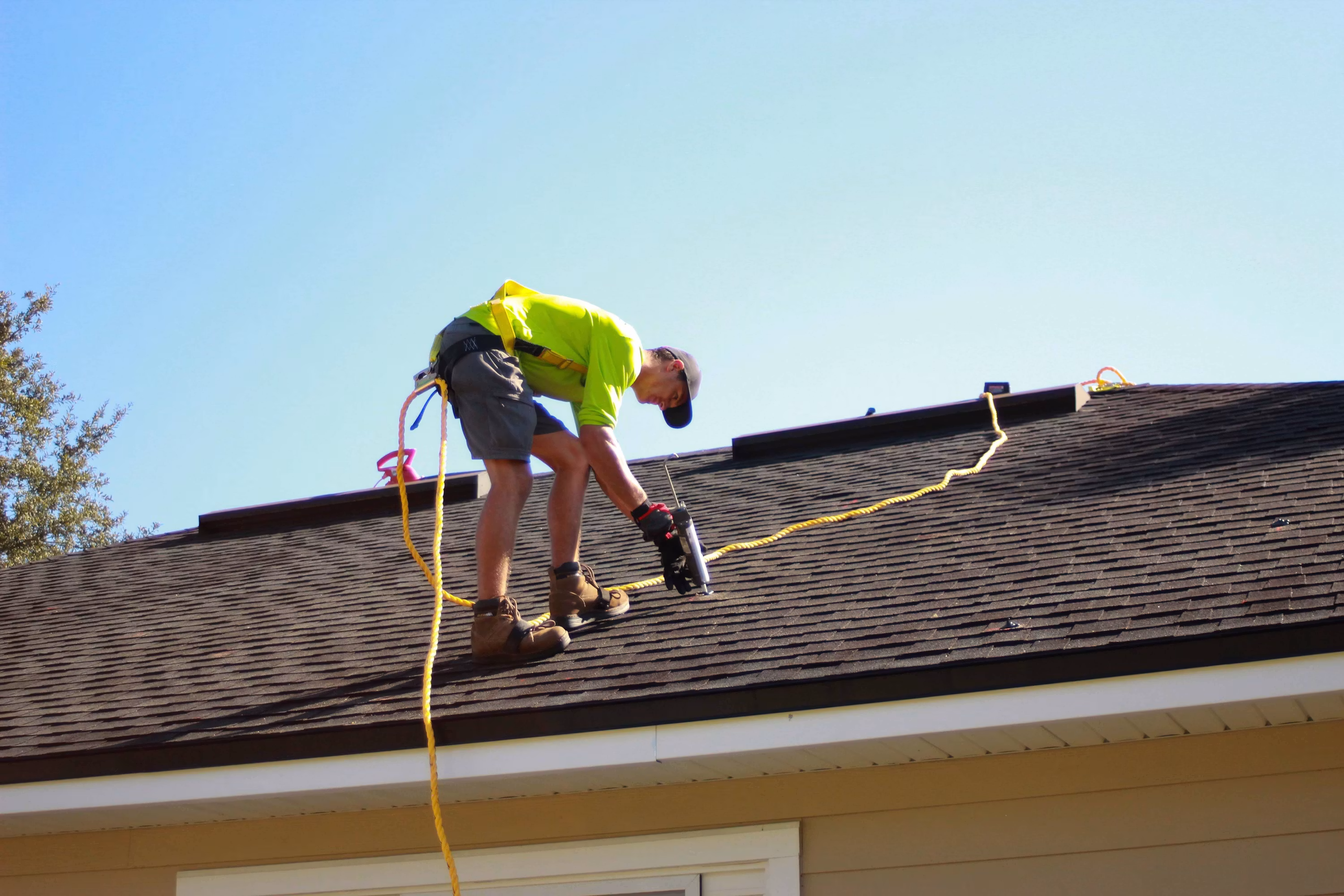 Professional roofer inspecting a roof
