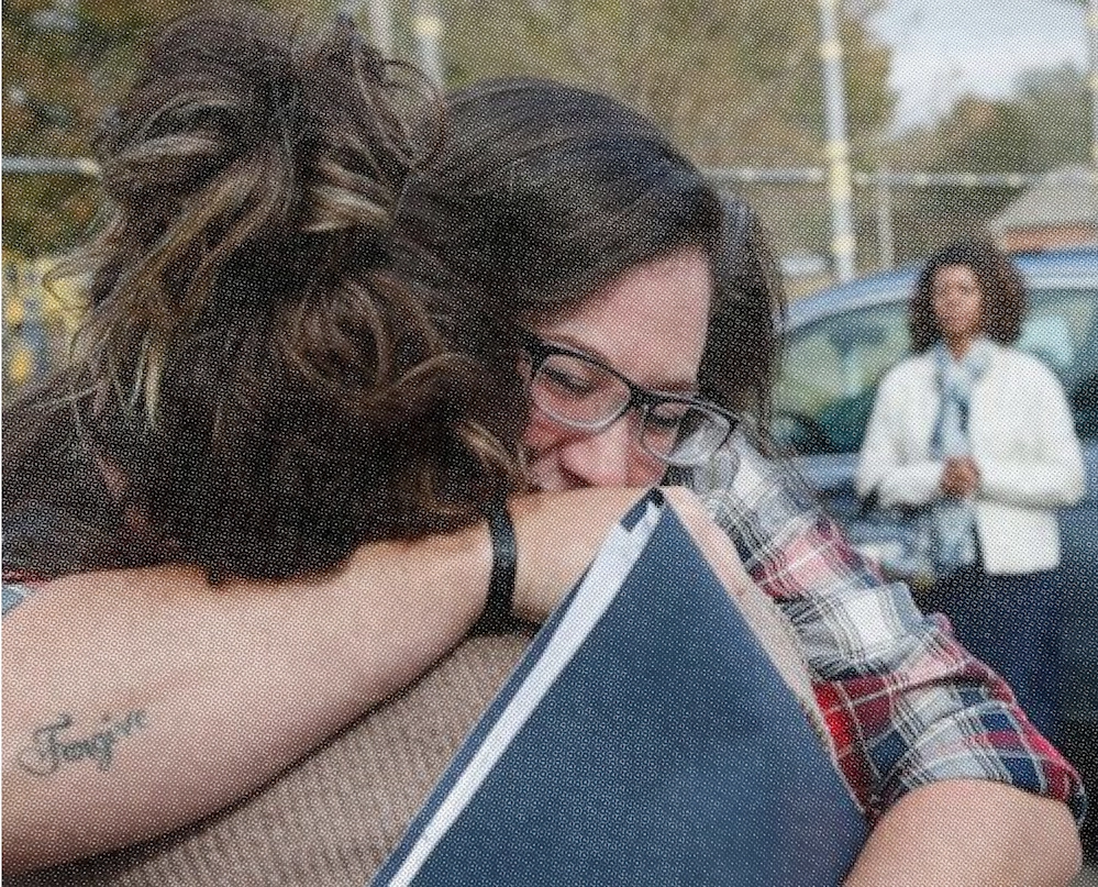 Two people hugging