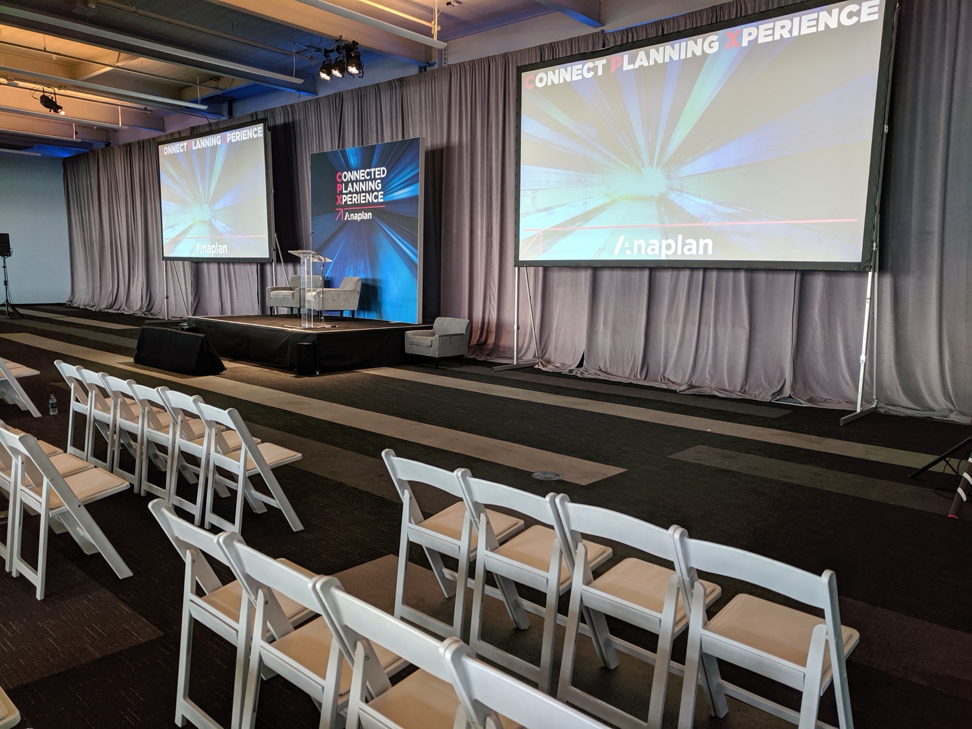 Stage, drape wall and projection screens built by Impact at Pier 27, San Francisco