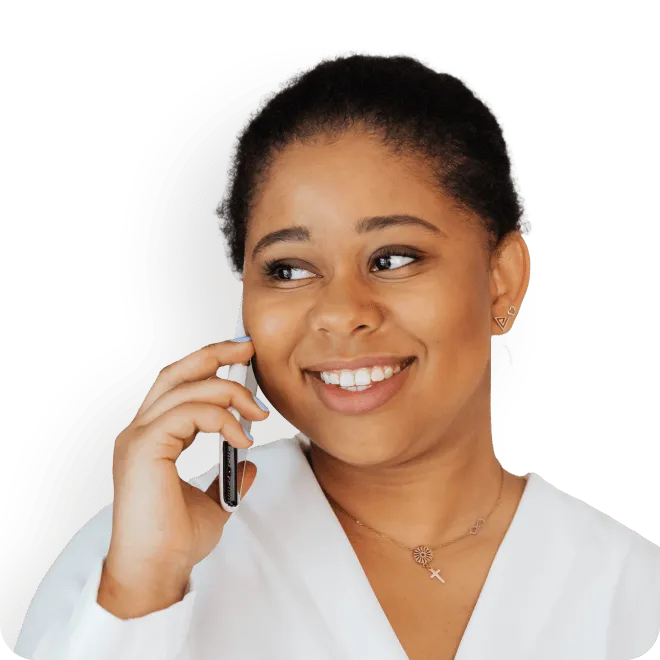 Woman smiling holding phone
