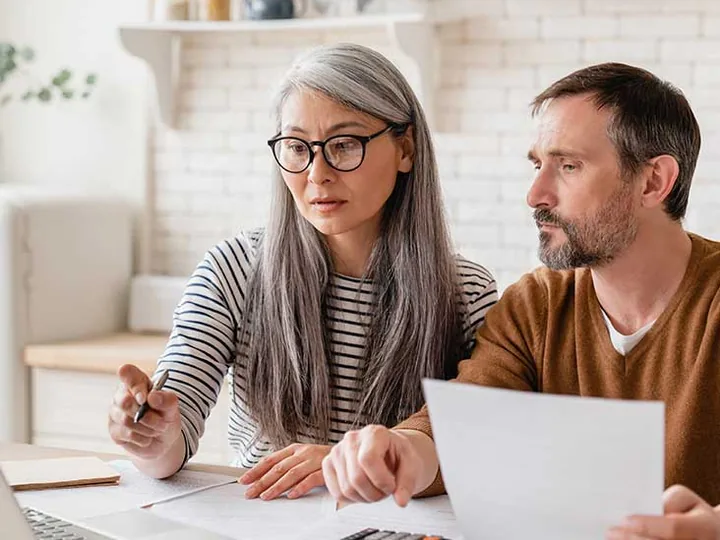 Sellers reviewing their offer paperwork