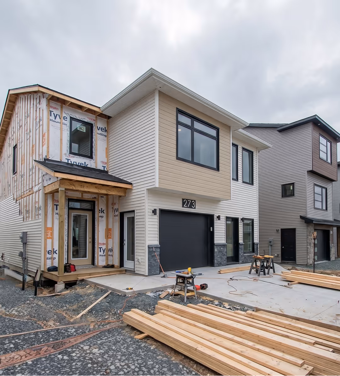 A home addition under construction in Halifax showing Tyvek weather barrier wrap and wood framing for a new secondary suite
