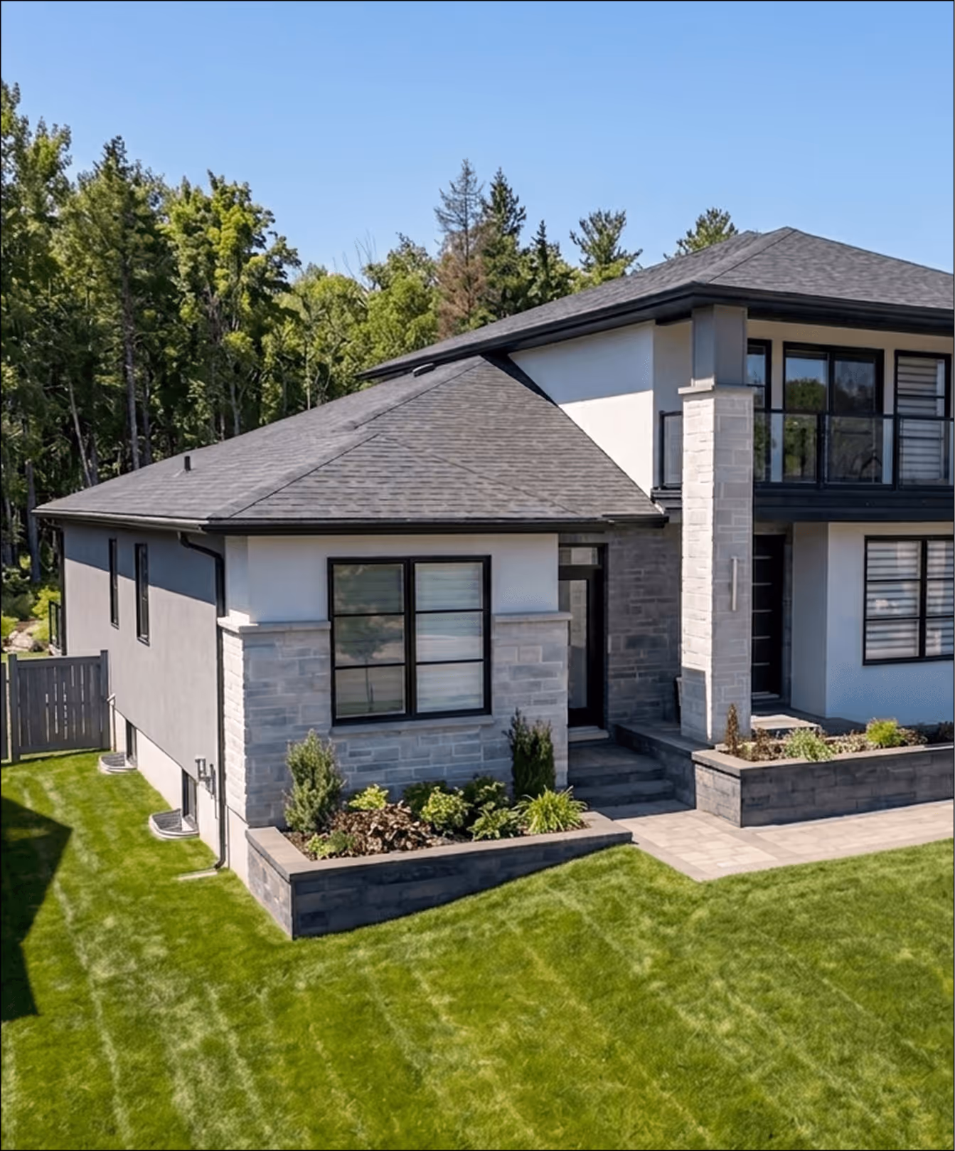 A designer at Signature Home Builders reviewing printed floor plans for a modern ADU specifically designed for the Nova Scotia climate