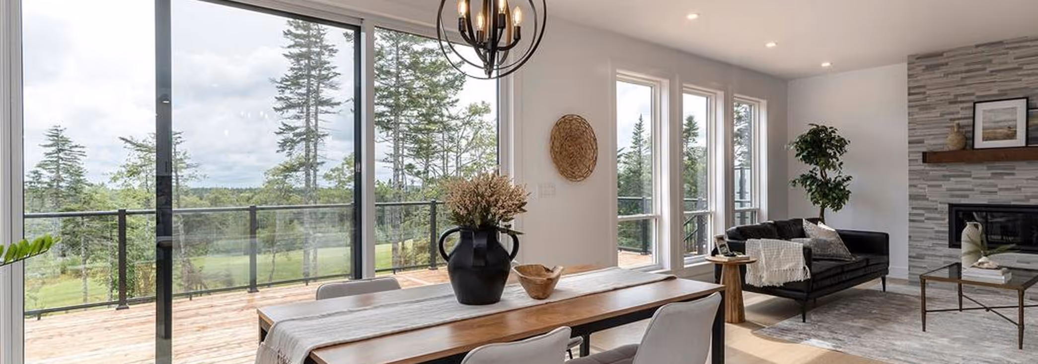Eco-friendly home interior with large windows, forest views, modern fireplace, and sustainable living spaces in Halifax
