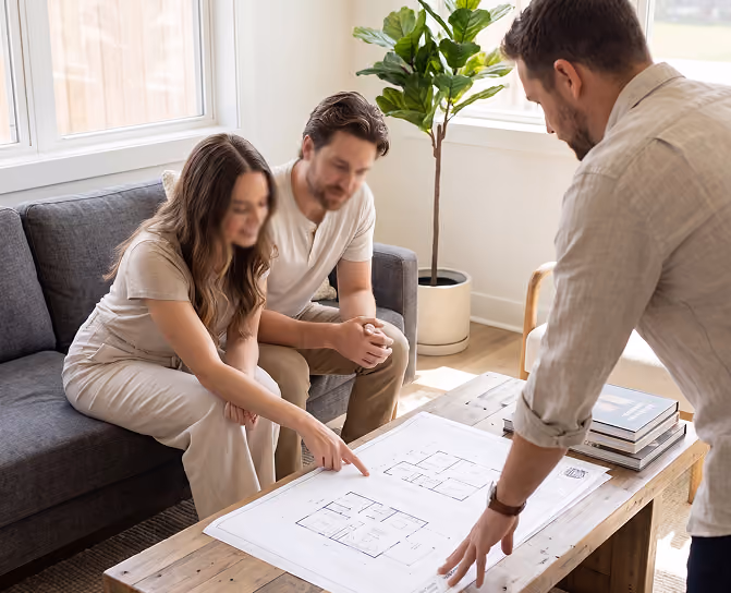 Homeowners reviewing custom tiny home and small house floor plans with designer on laptop in Halifax
