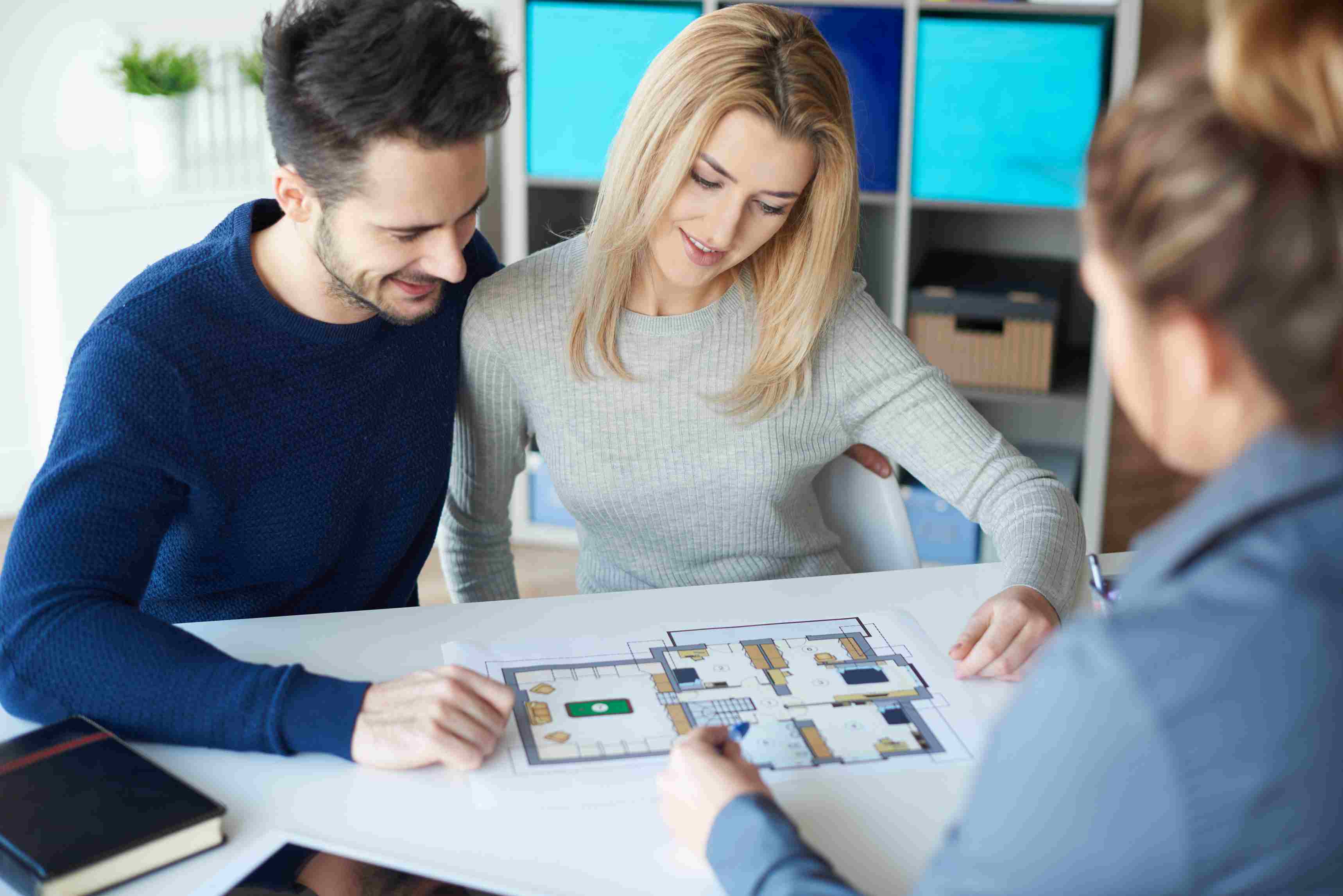 Clients checking a home design made with a professional builder