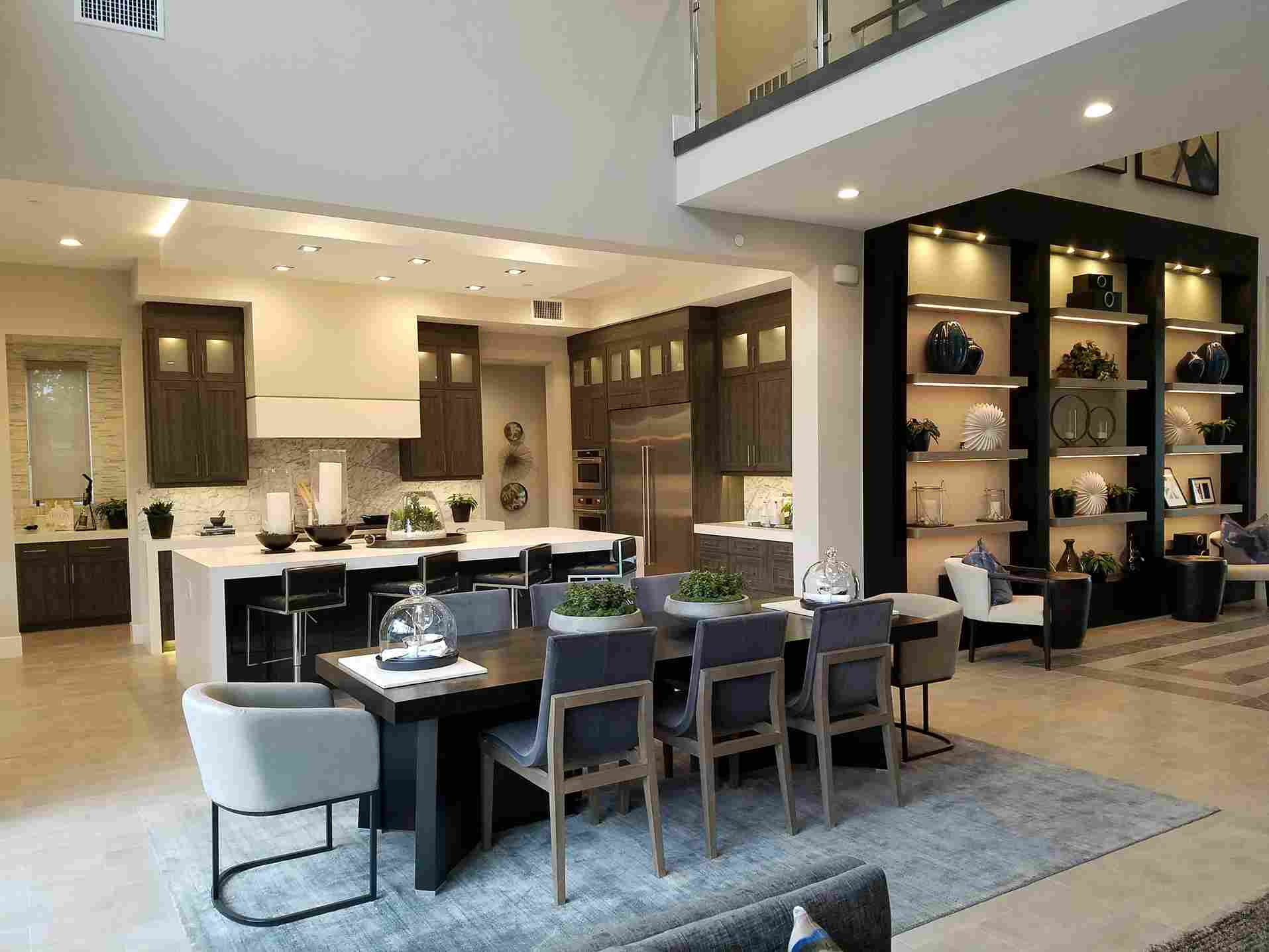 Modern dining room with contemporary lighting fixtures and smart home features in custom modern house Halifax - integrated technology design by Signature Homes Nova Scotia