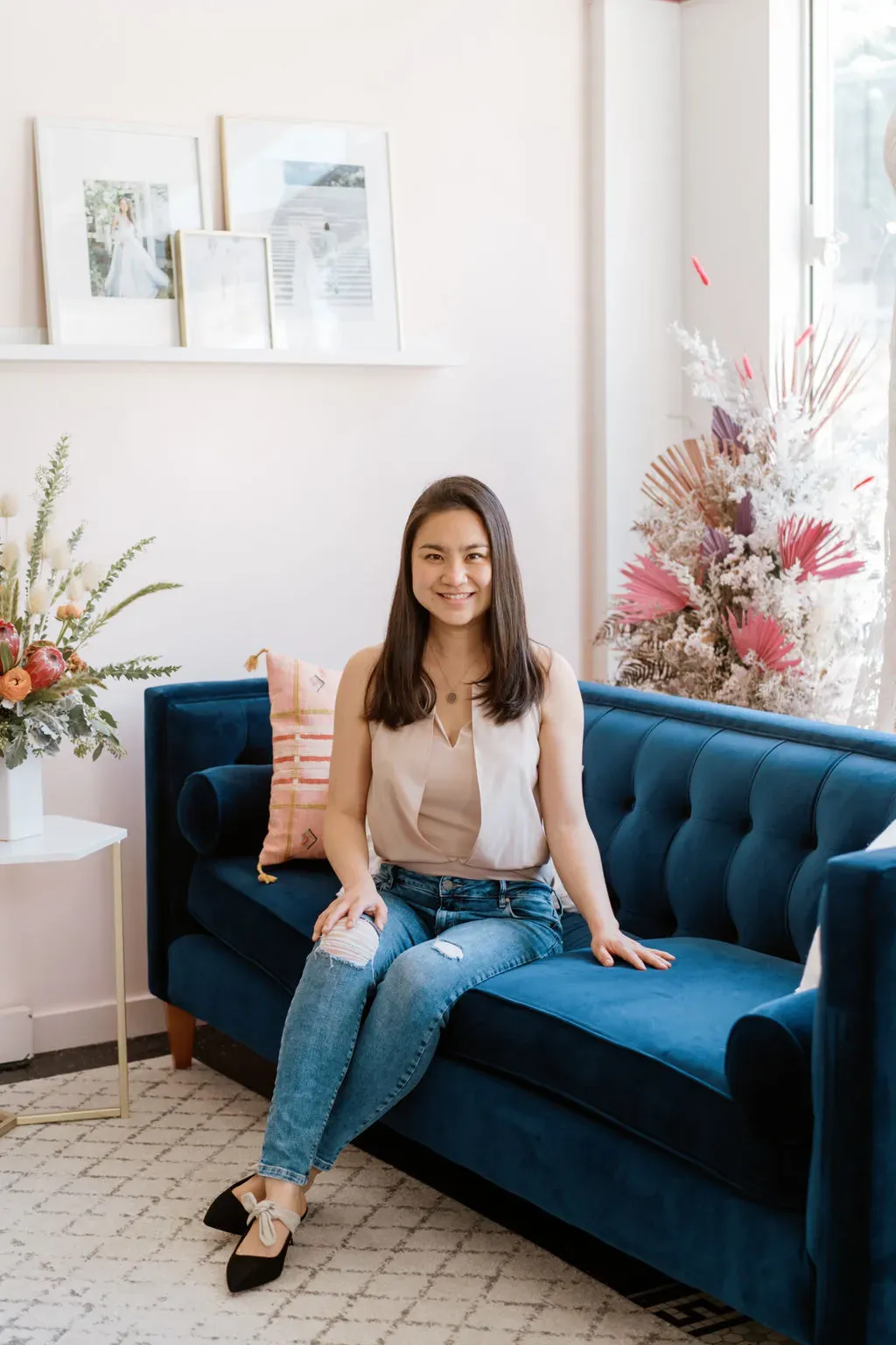Danielle Wen, founder of Lace & Liberty, sitting in their San Francisco showroom