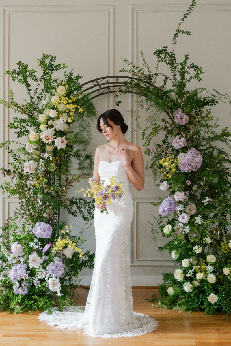 The entire dress is adorned with an intricate, dimensional floral lace pattern.