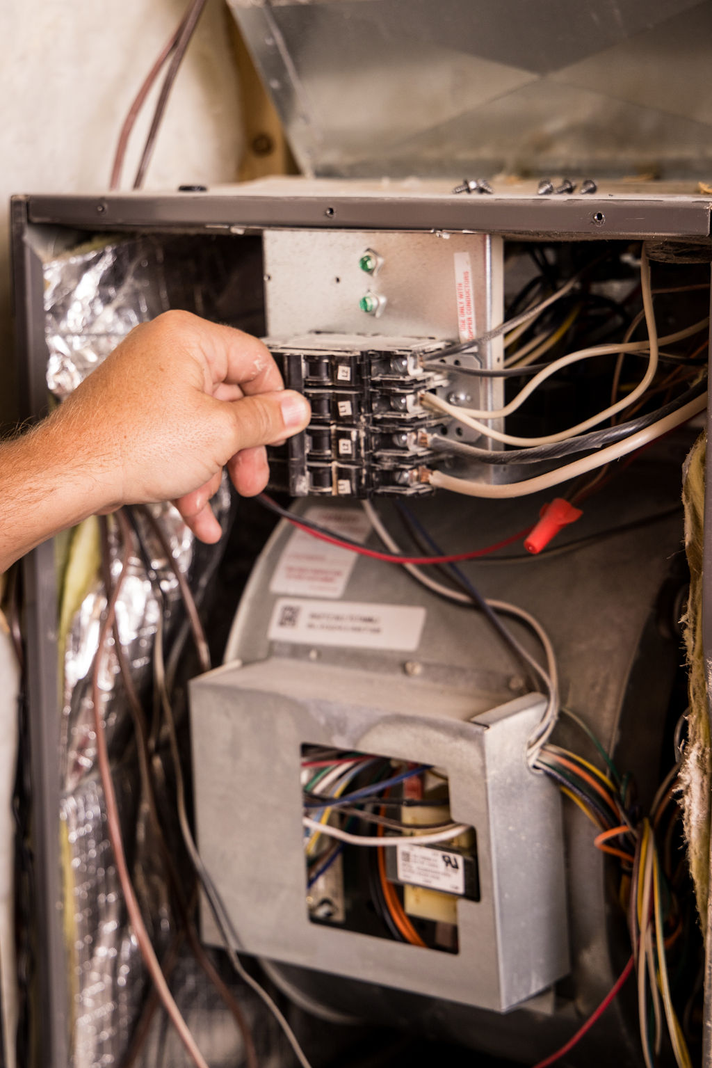 Prudential Heating and Air Louisville technician performing furnace repair to restore reliable heating service.