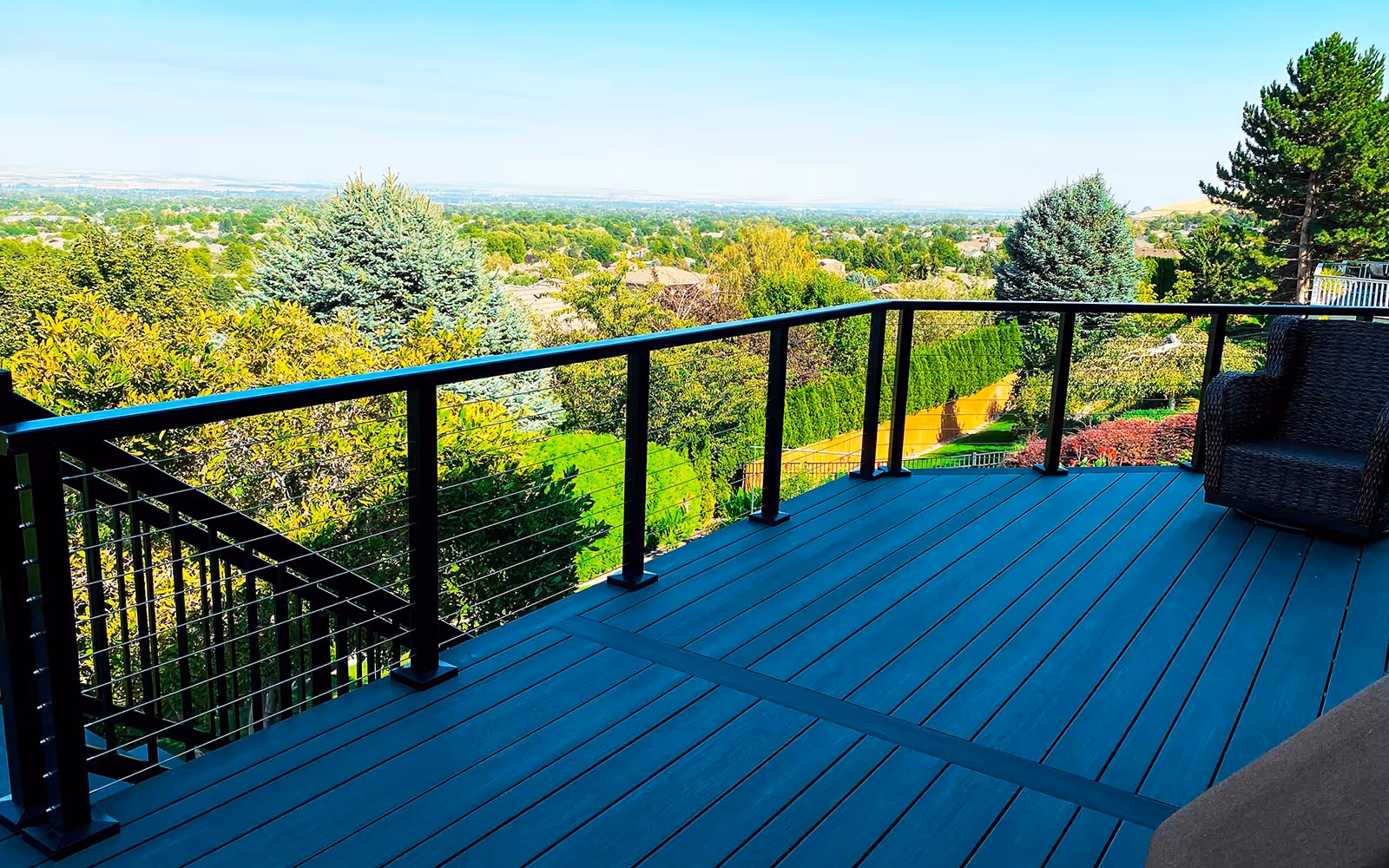 Composite deck with accent picture frame and cable railing in Sugar Hill by Fulton Decks
