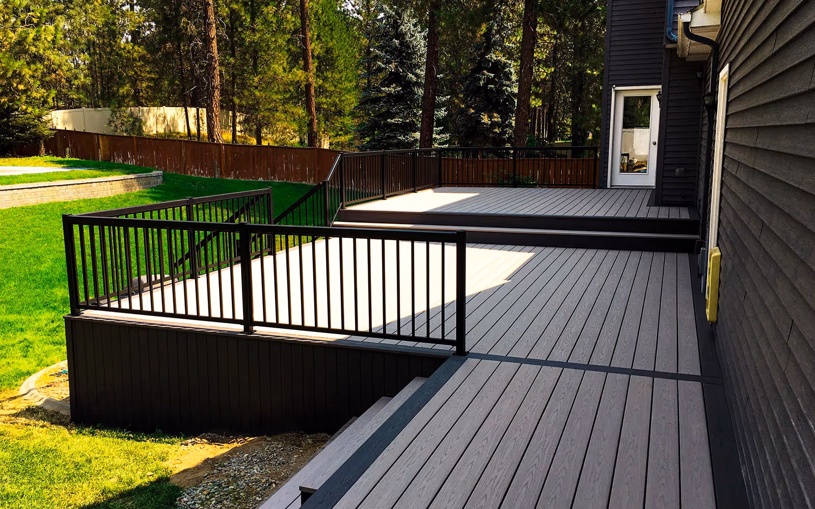 2 levels deckorators gray deck with black aluminum railings in Forsyth County by Fulton Decks