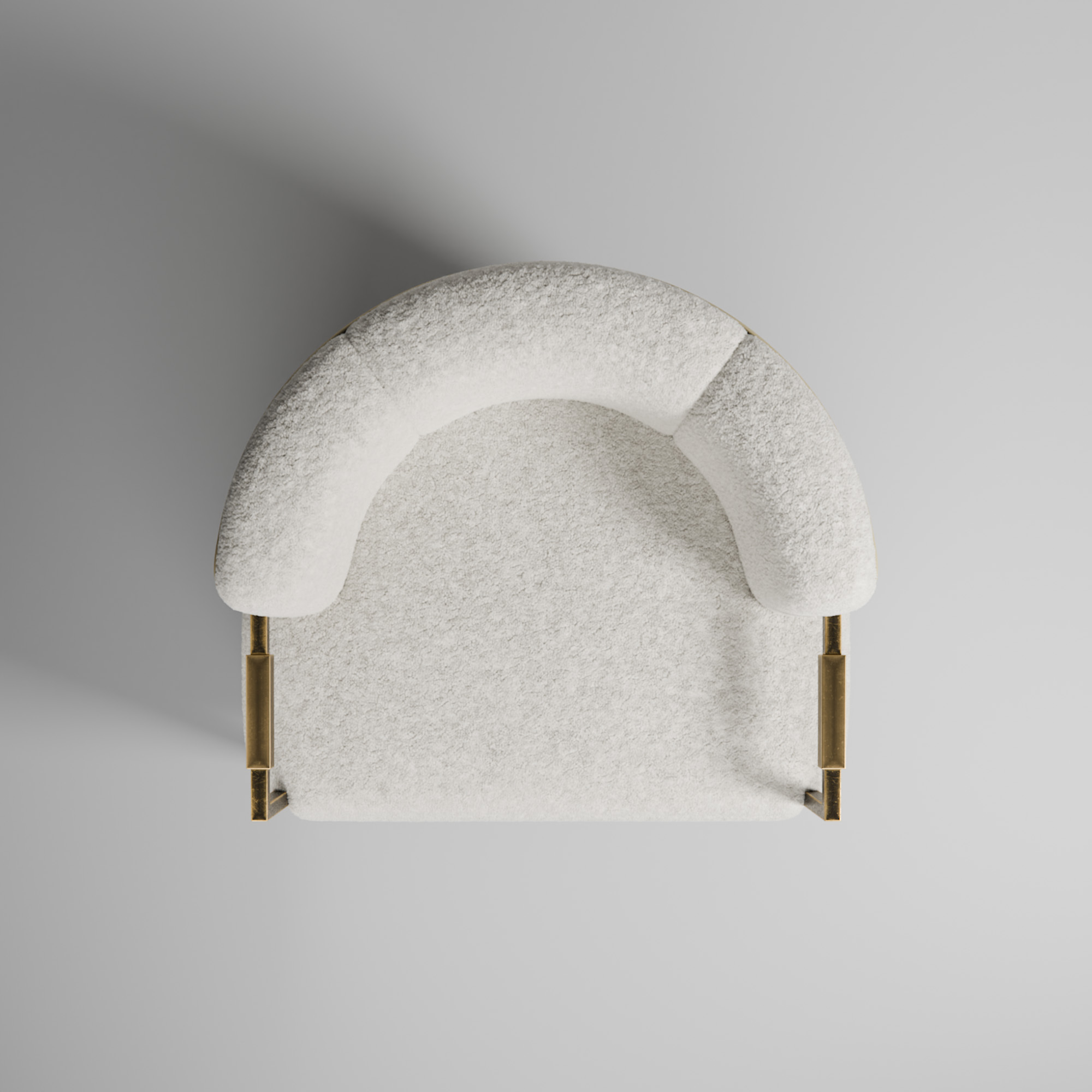 An overhead studio quality image of a fuzzy luxurious chair with brass handles.