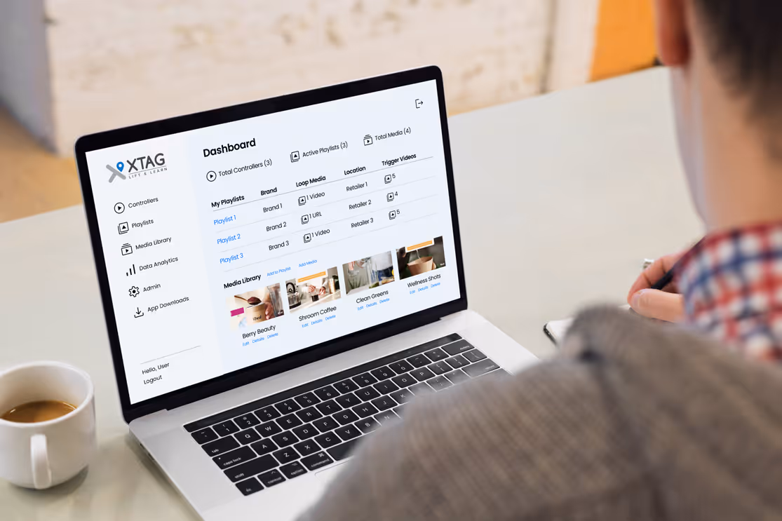Person looking at laptop screen showing CMS dashboard
