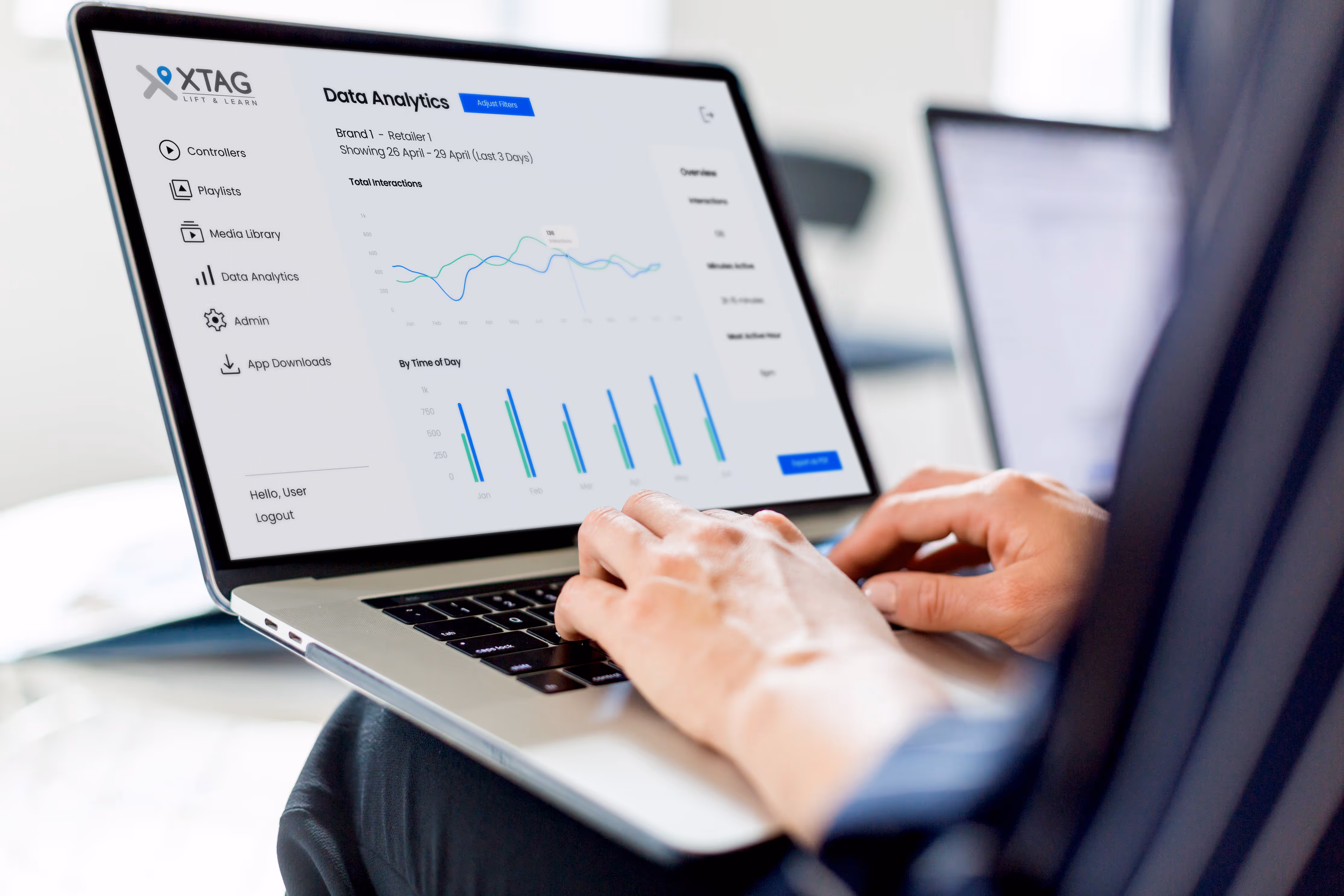 Person looking at laptop screen showing analytics dashboard