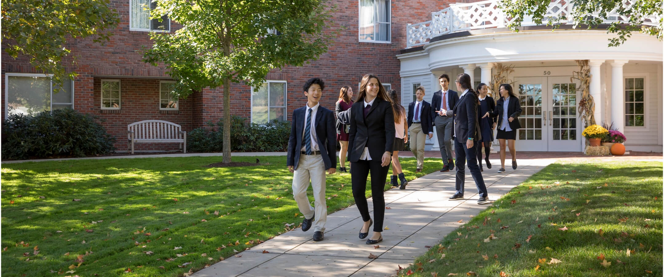 Fay School students walking out of a building on campus.