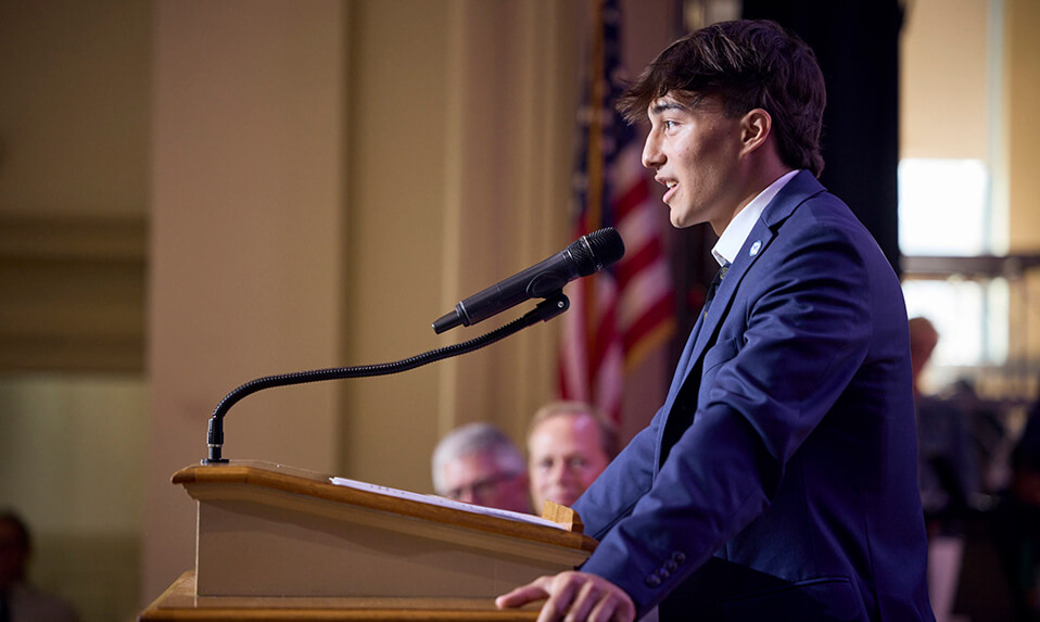 A McCallie student on stage giving a speech.