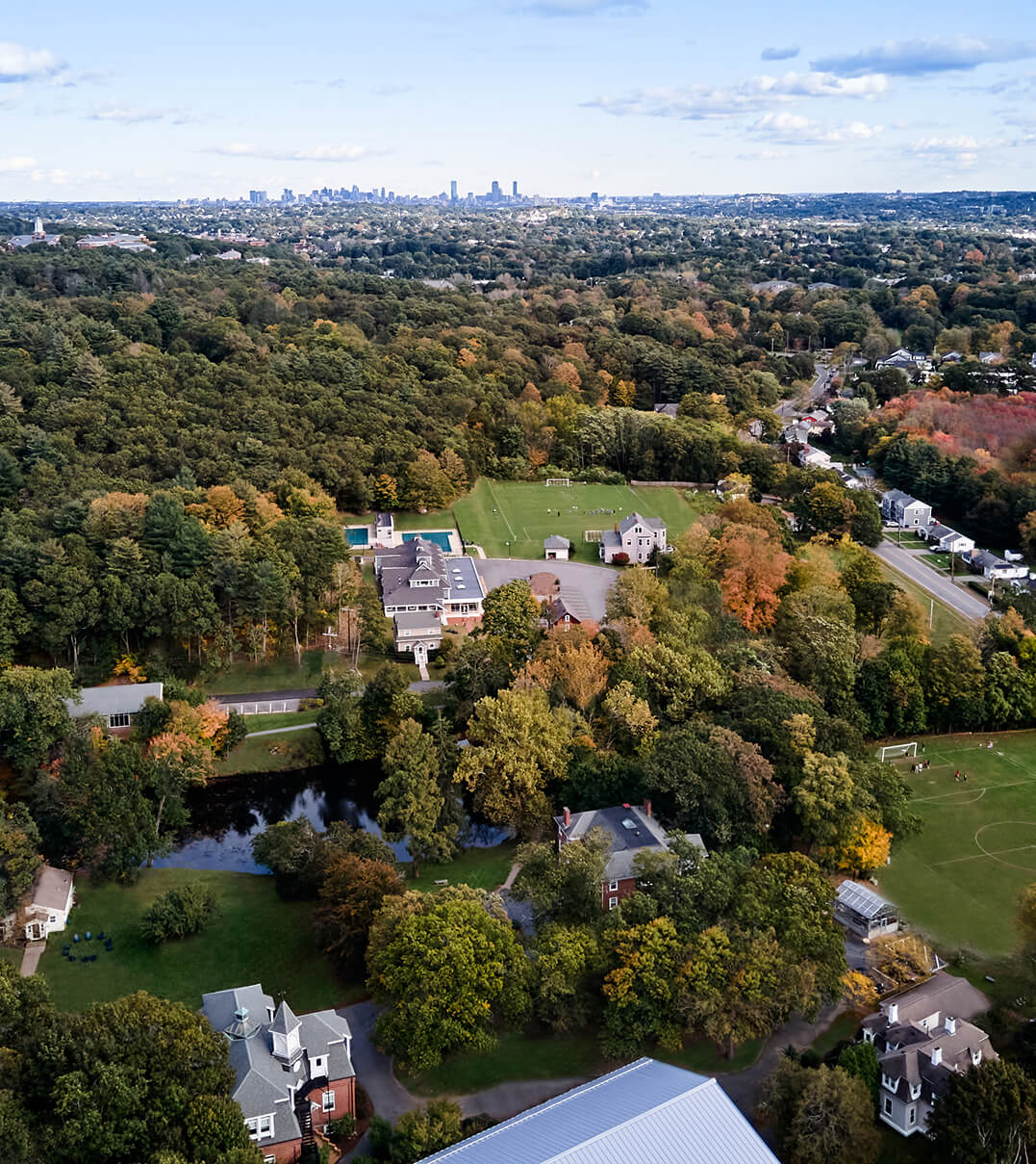 Aerial view of Chapel Hill-Chauncy Hall's campus with Boston in the background.