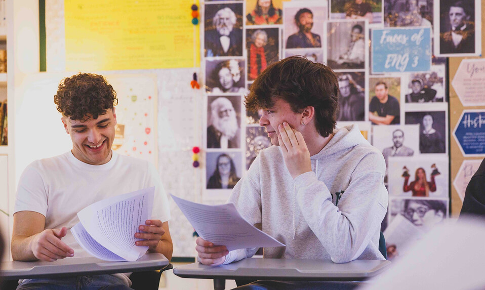 Stevenson School students discussing their papers.