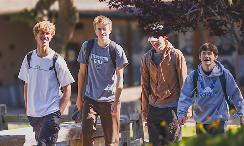 A group of Stevenson School students walking across campus in the sunshine.