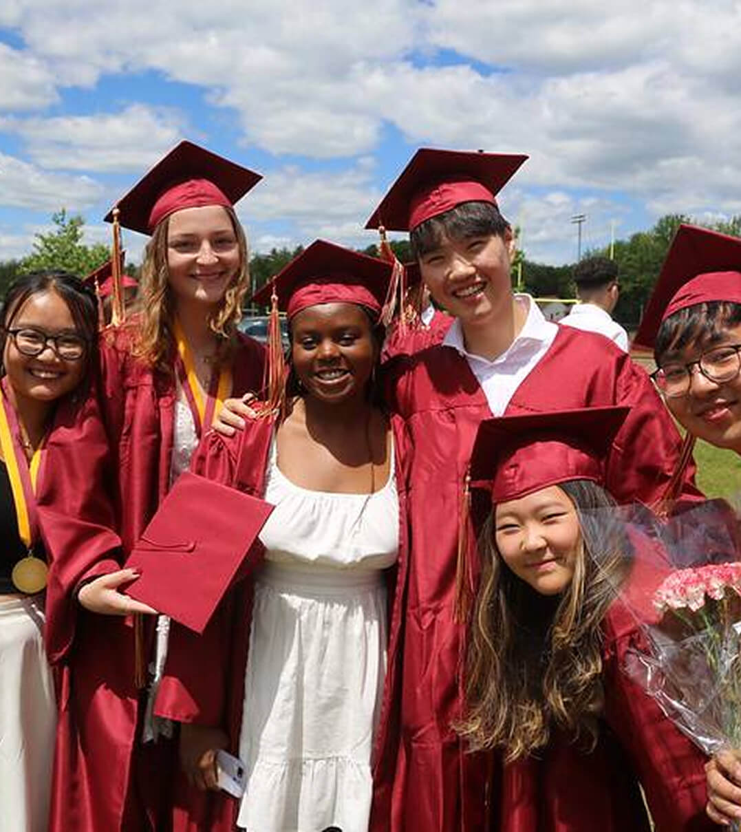 Thornton Academy graduates in their maroon caps and gowns.
