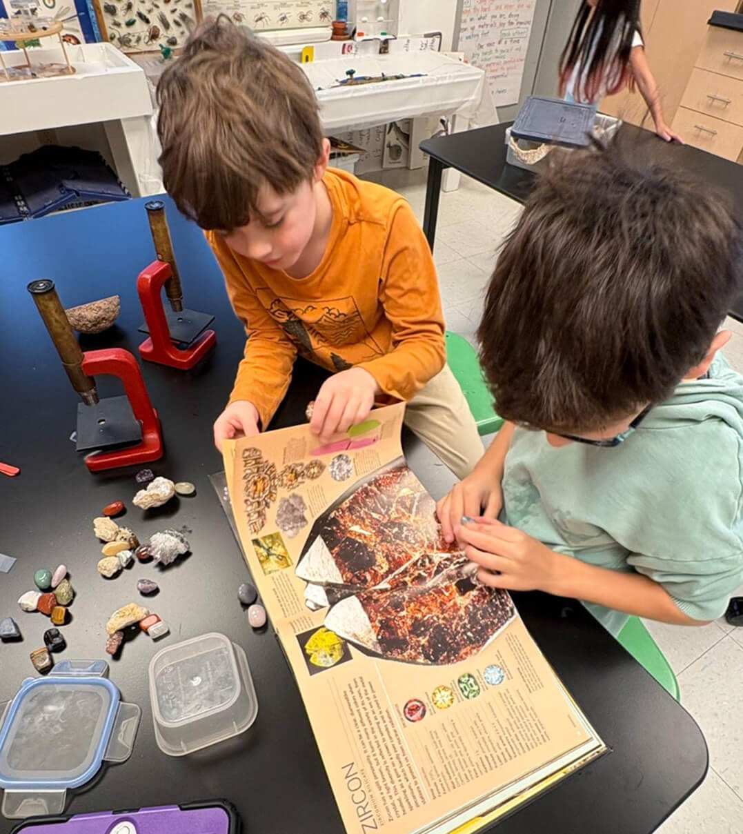 Two Long Ridge students explore different types of rocks and gems.