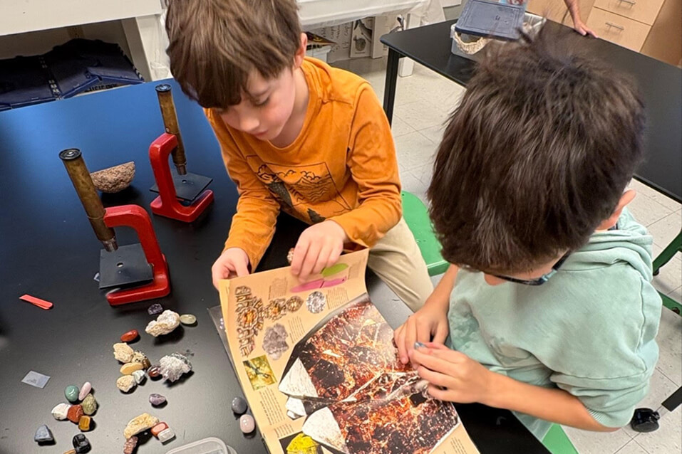 Two Long Ridge students explore different types of rocks and gems.