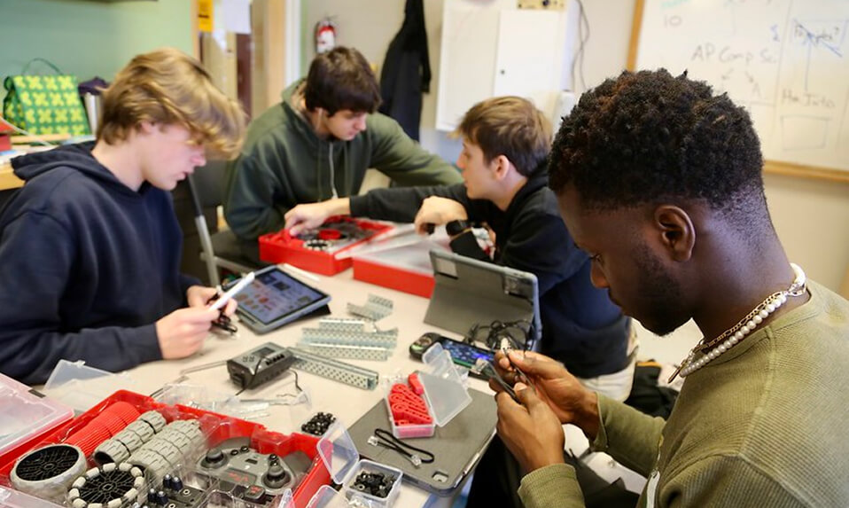 Thornton Academy STEM students working on a robotics project.