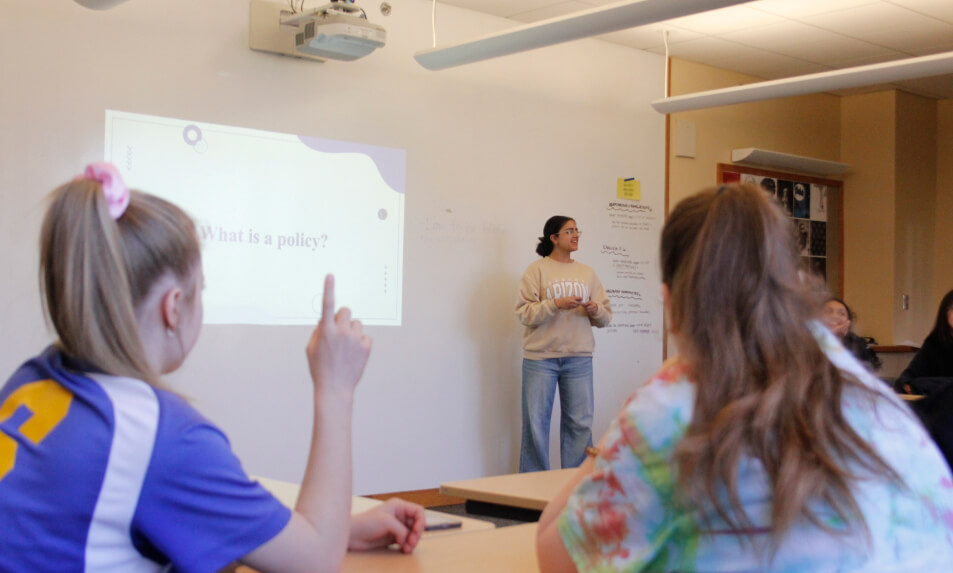A Miss Hall's School student leading a classroom lecture.