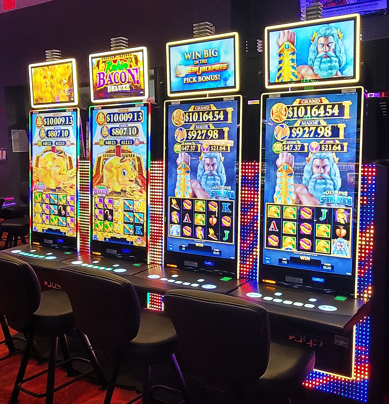 Rakin' Bacon Deluxe Pirate Plunder and Olympus Strikes by AGS at Pawnee Stonewolf Casino.