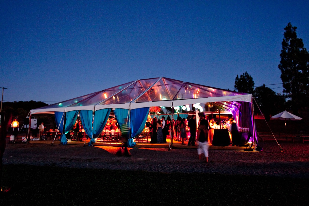 Wedding tent ceiling washed in color
