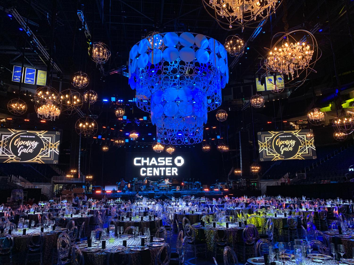 Chase Center gala under a deep blue chandelier installation
