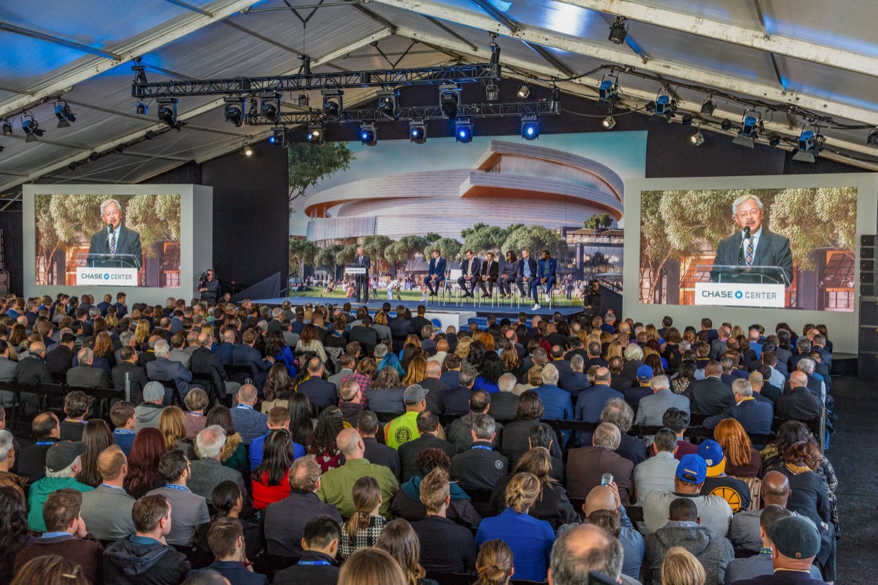 Impact staged the Warriors Chase Center groundbreaking with a keynote stage, dual IMAG screens, and moving lights under a clear-span tent.
