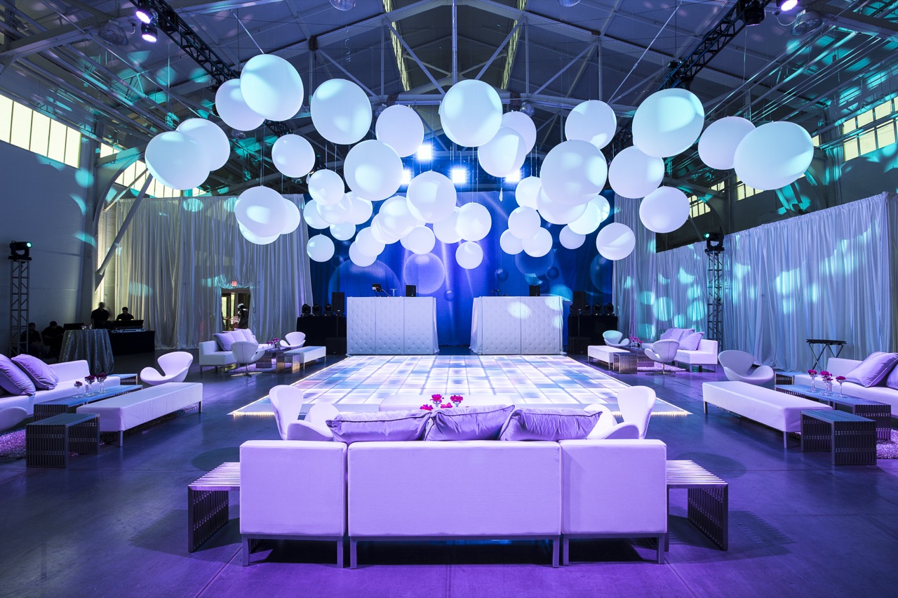Impact's sparkling illuminated columns, crystal chandeliers, and an amethyst ceiling wash light an ISES gala at Fort Mason.