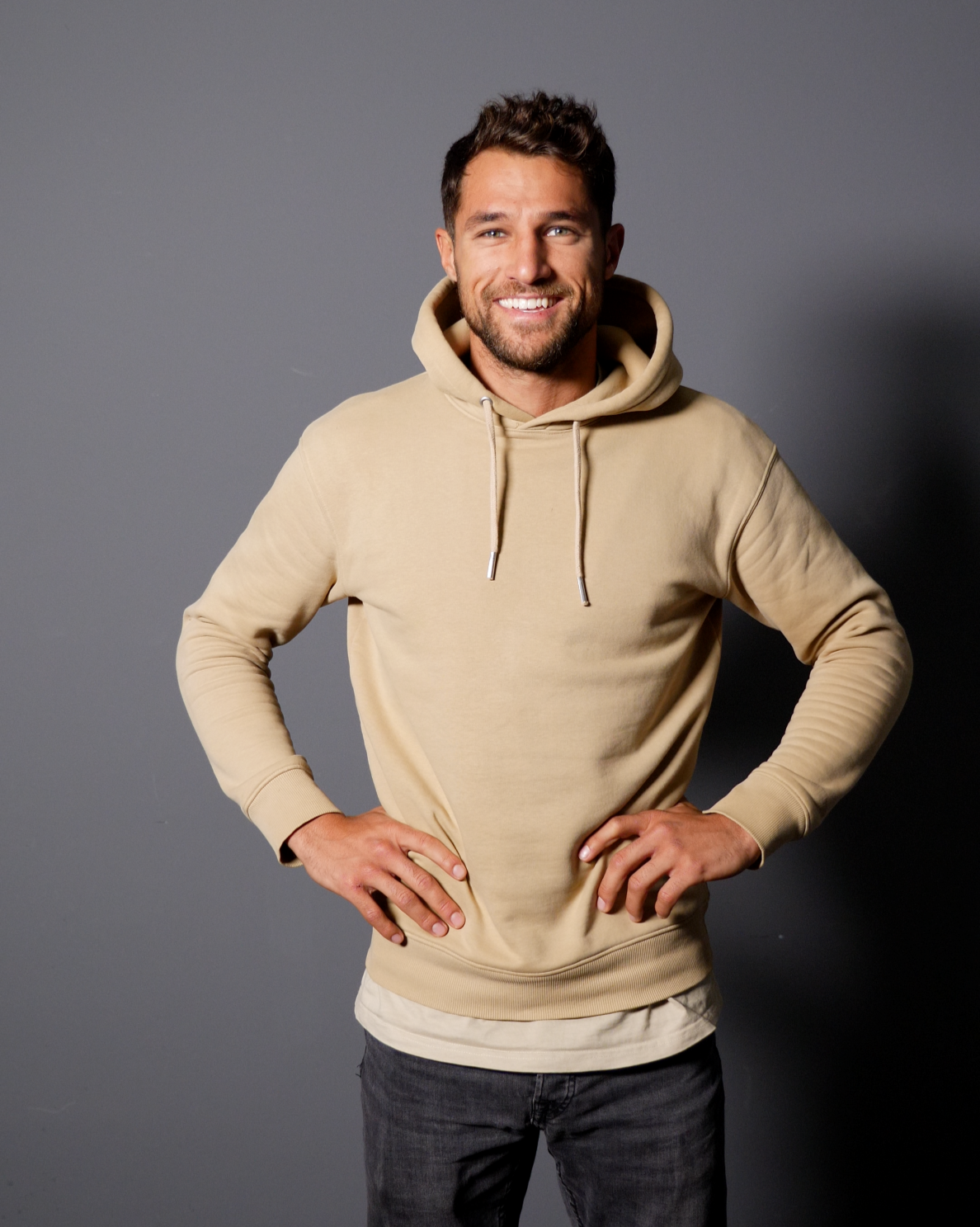 a man standing in front of the camera smiling