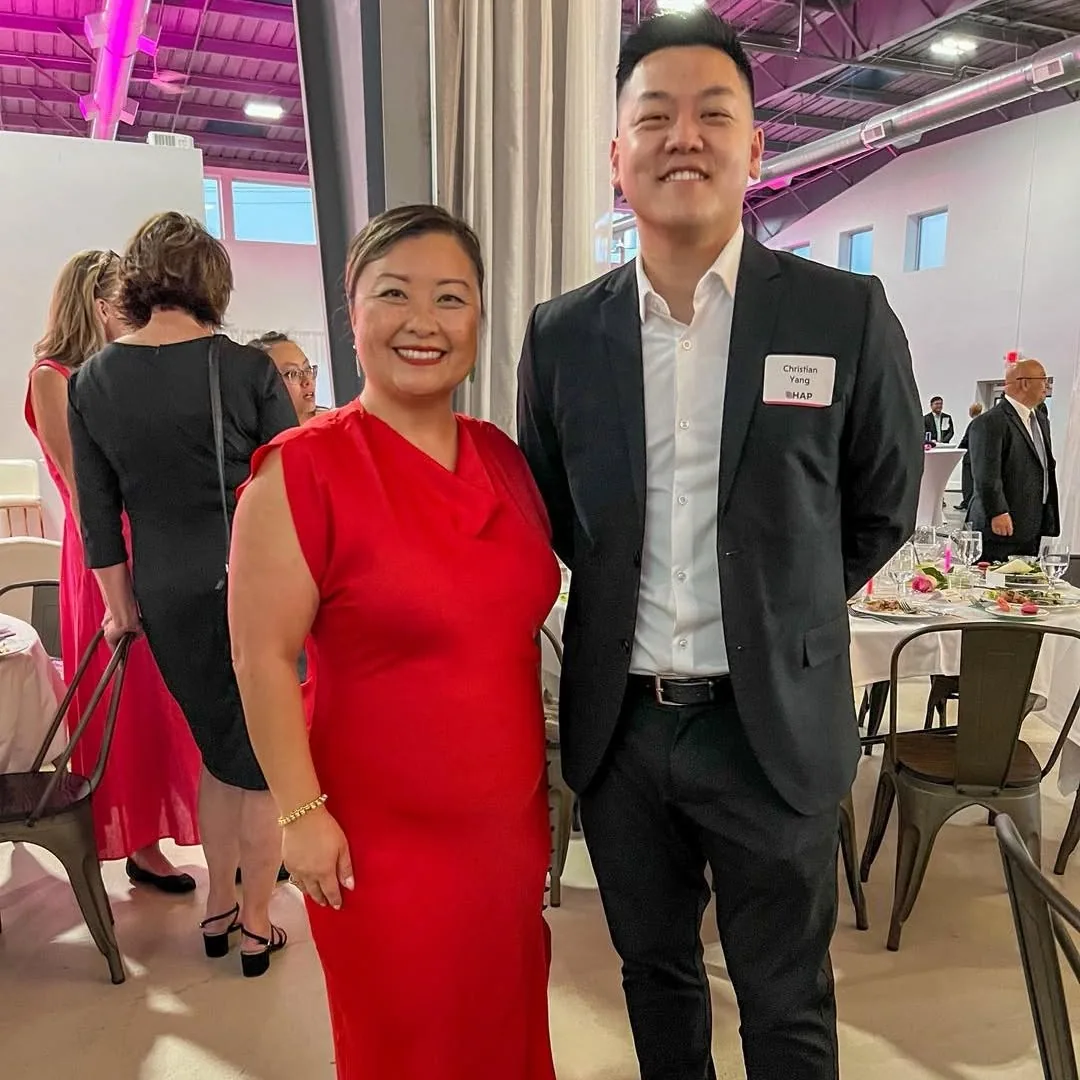 Christian Yang with May Yer Thao, CEO of Hmong American Partnership, at a HAP gala