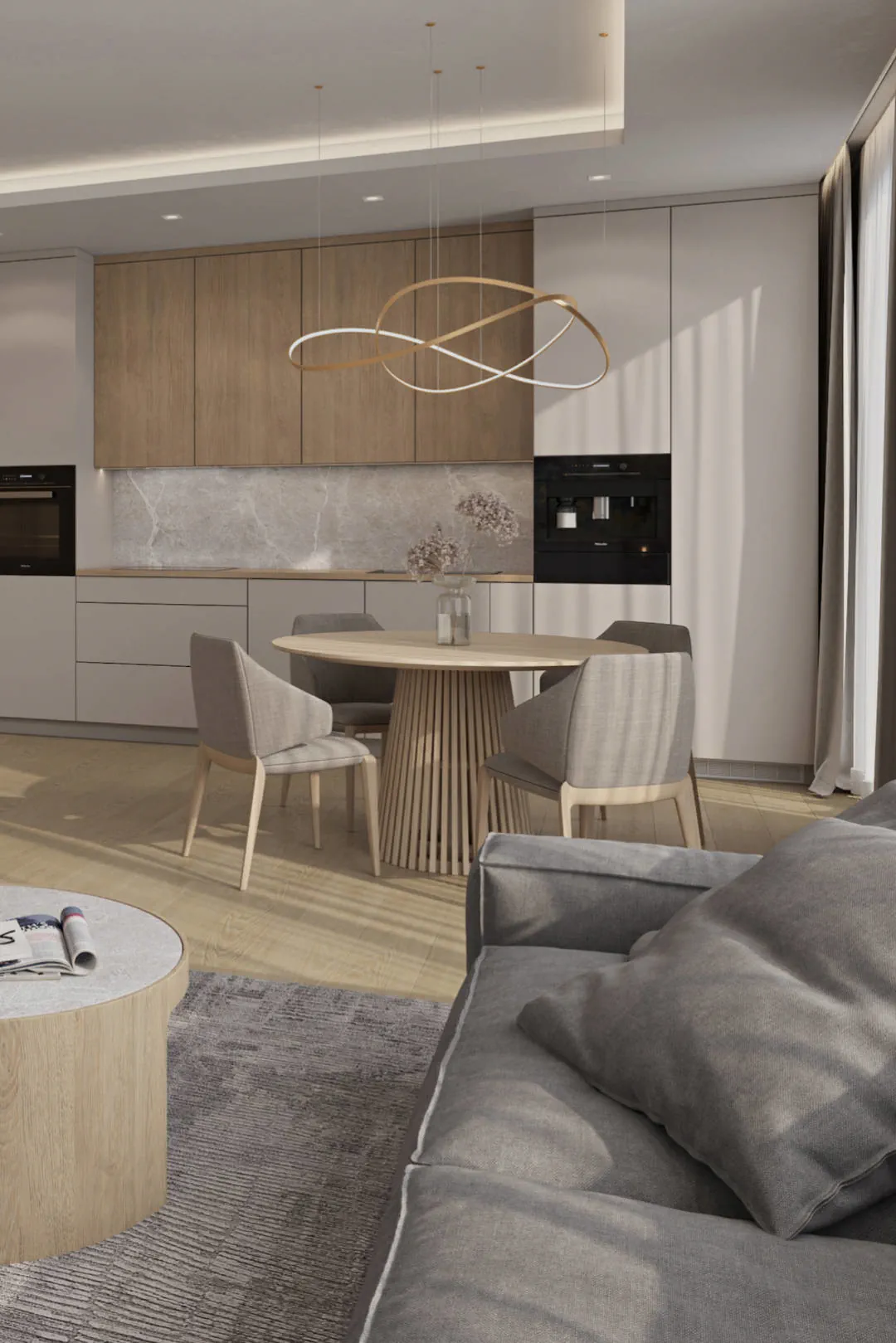 Výrazné prvky kulatého stolu a designového lustru oživily strohý minimalismus interiéru.