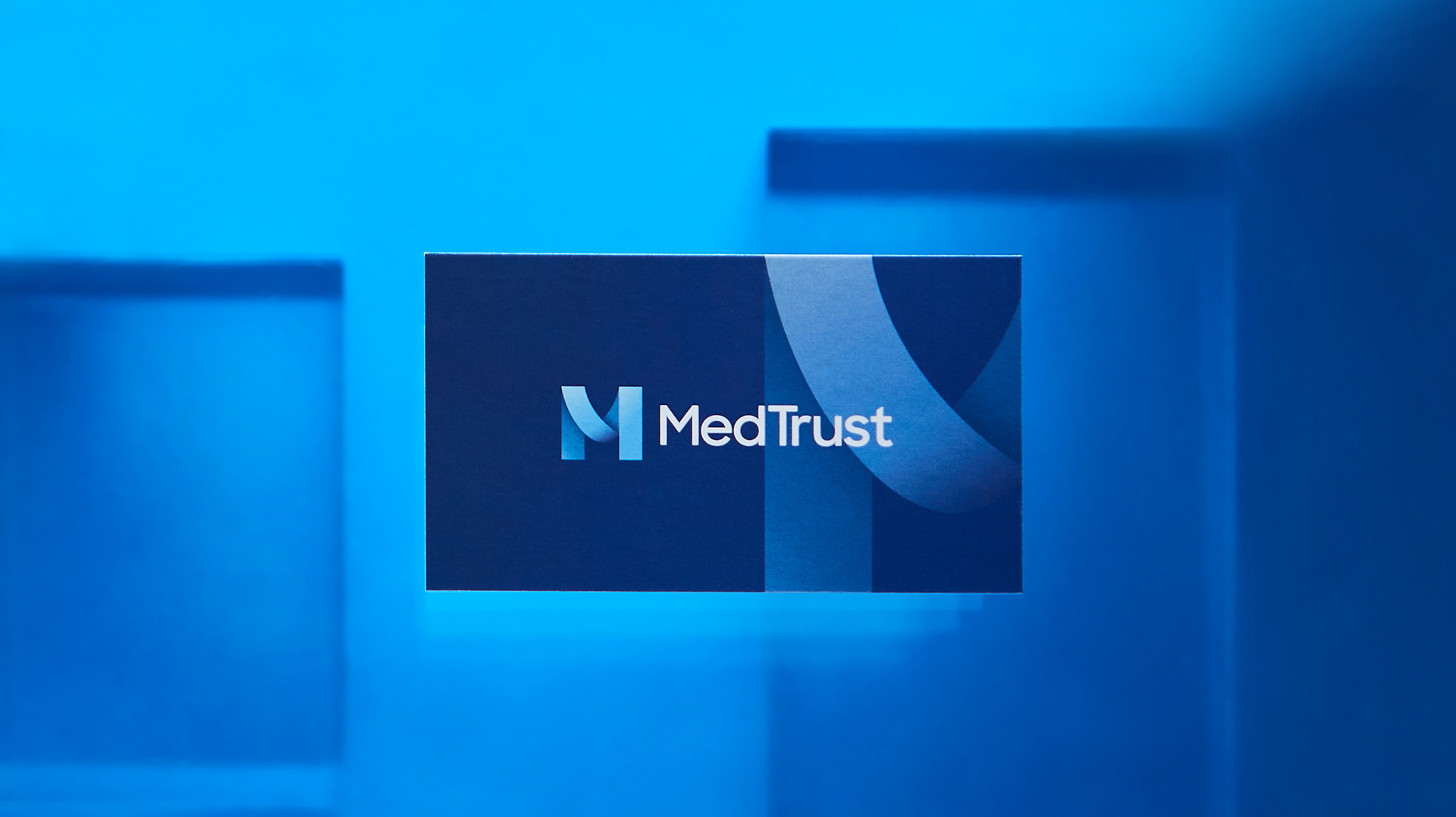 MedTrust branded, die-cut sales  pocket folder package design showing semi-open view.
