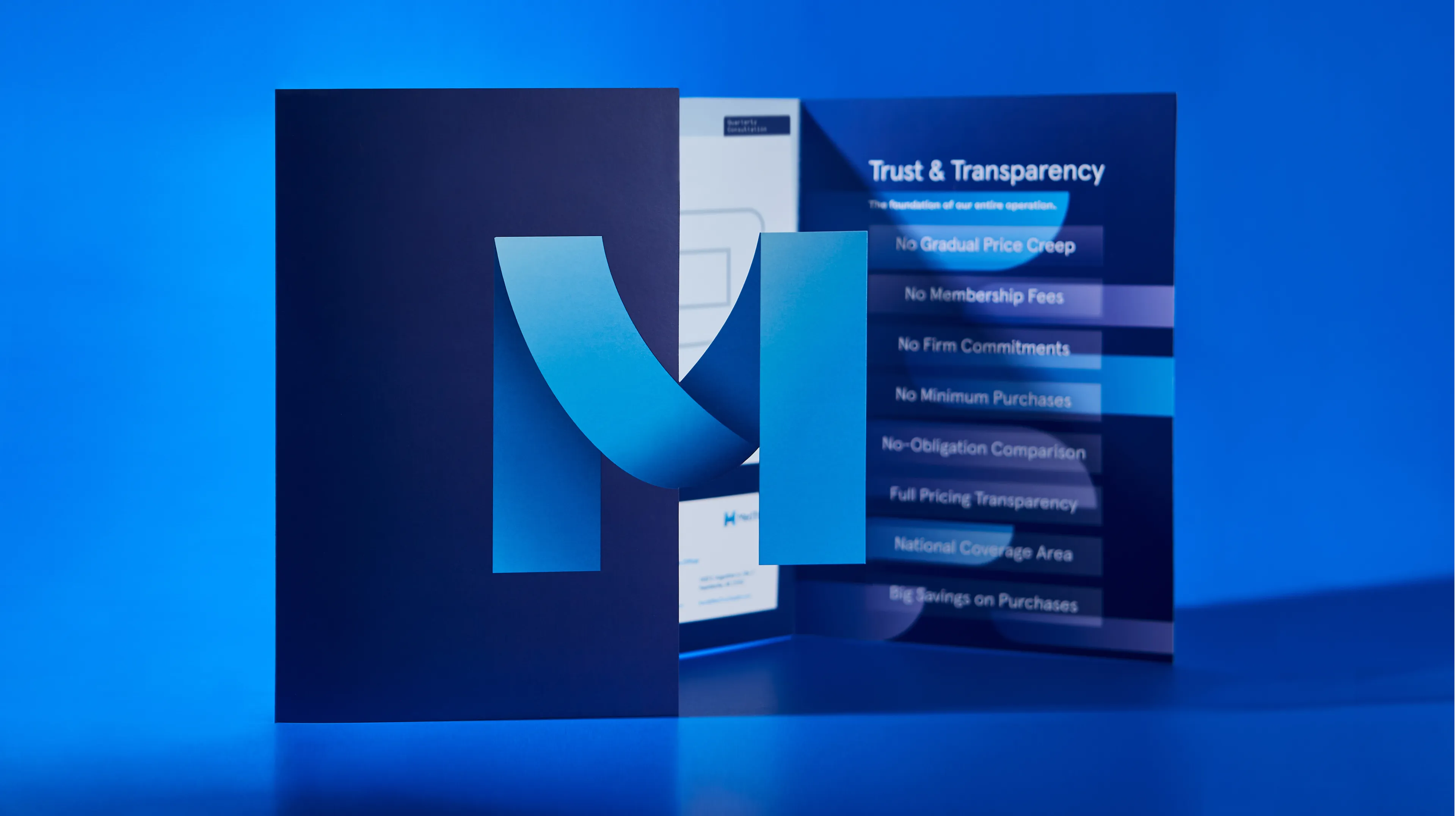 MedTrust navy blue brand folder and trust and transparency brochure displaying no-fee GPO value propositions alongside M logo mark, designed by Unbound Collective