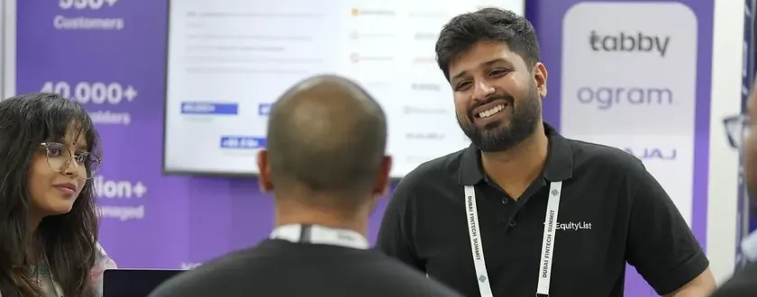 The EquityList team talking with visitors at their Dubai FinTech Summit booth